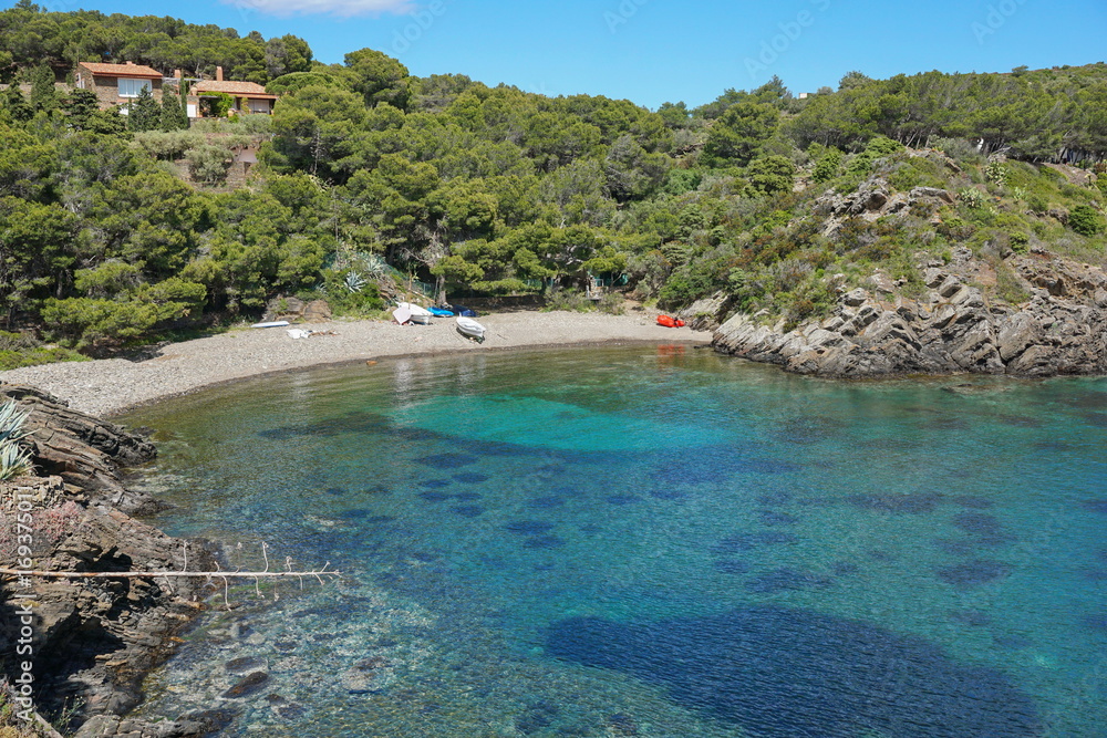 Spain Costa Brava peaceful pebble beach of the Mediterranean sea, Cala Guillola, Cadaques, Cap de Creus, Catalonia