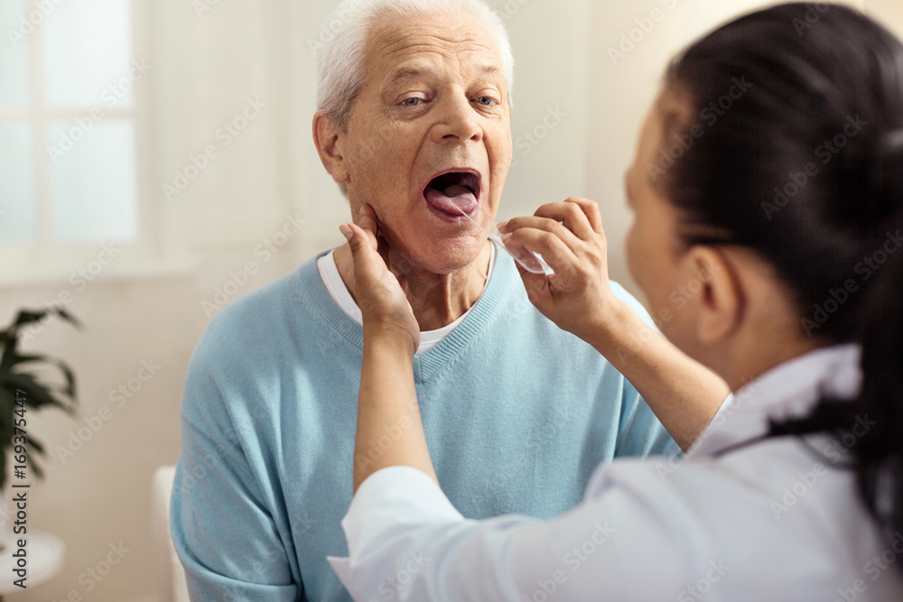 Nice professional nurse holding a plastic stick Nice professional nurse holding a plastic stick