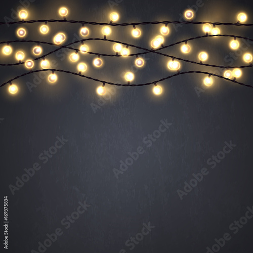 Yellow Christmas incandescent light strings on the dark gray background. Vector design elements.