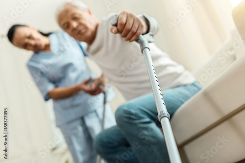 Fotografia Professional walking stick being held by a nice elderly man