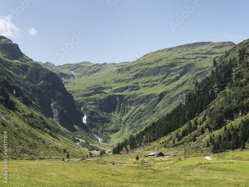 Scenic Alpine rocky alpine valley of Sportgastein in summer. Picturesque mountain pasturelands, great mountain massif and sunny weather. Sport hiking landscape background.