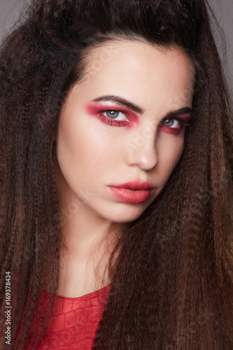 beautiful girl with red eyeshadows make-up