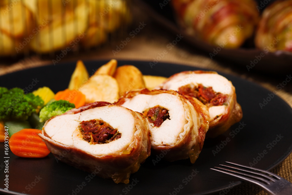Delicious chicken rolls with dried tomatoes and mozzarella. Delicious chicken rolls with dried tomatoes and mozzarella.