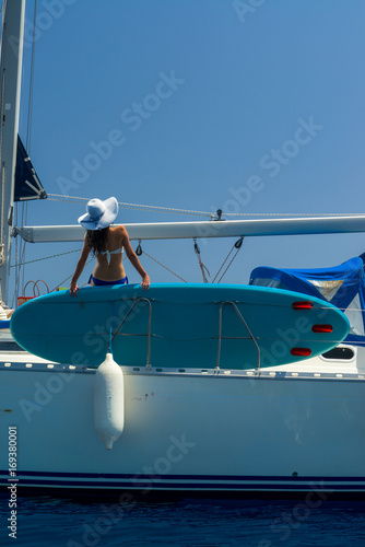 Woman on a sailing boat in the Ionian sea