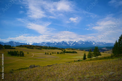 Pictorial landscape of snow peaks of North-Chiyski ridge and Kurai steppe in Altai mountains. Republic of Altay, Russia.