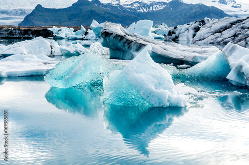 Floating icebergs in the glacial lake Jokulsarlon in Iceland photo