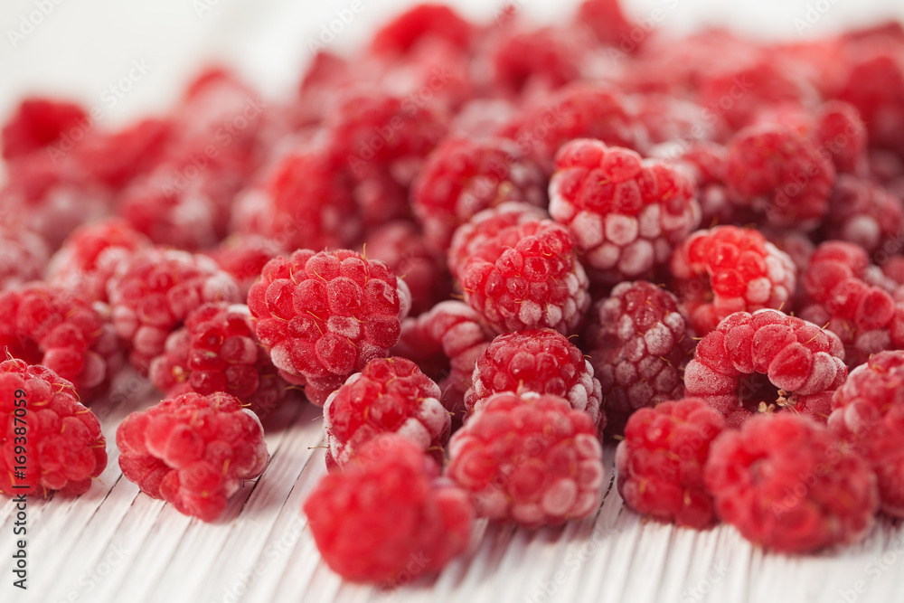 Raspberries in a frost on a light background Raspberries in a frost on a light background