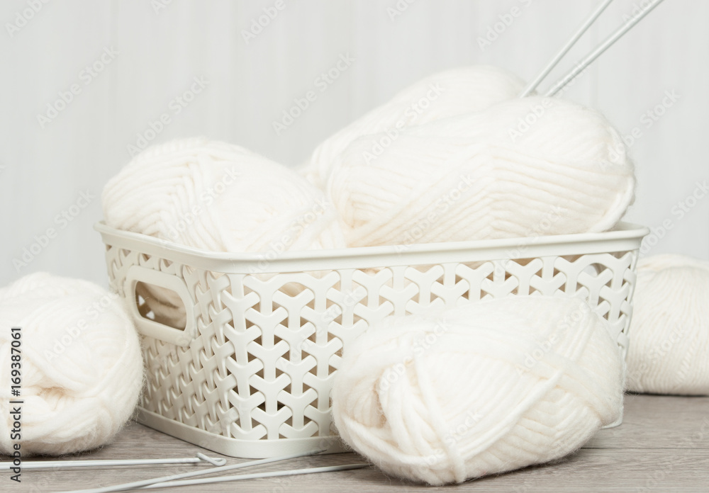 Natural Wool Yarn Balls. Knitting Needles. Natural Wool Yarn Balls. Knitting Needles.