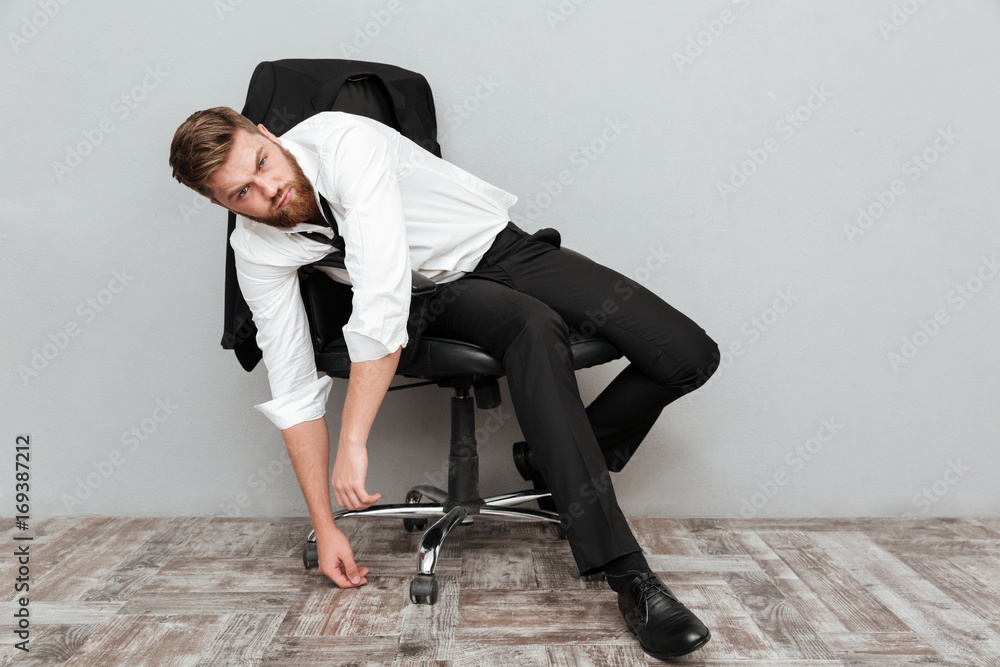Tired drunk businessman resting in office chair Tired drunk businessman resting in office chair