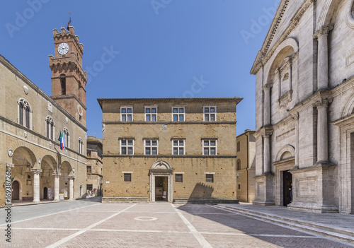 The facade of the Palazzo Borgia or Vescovile on the beautiful Piazza Pio II in the historic center of Pienza, Siena, Italy, on a sunny day
