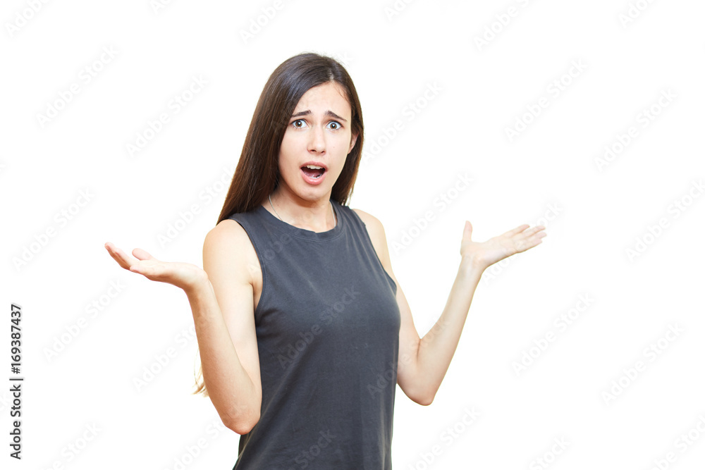 Portrait of a surprised and happy woman pointing at the copy space isolated on white background Portrait of a surprised and happy woman pointing at the copy space isolated on white background
