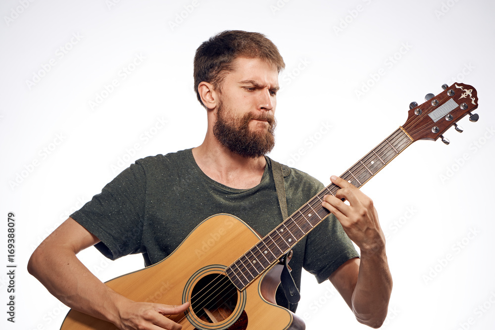 The musician plays the guitar