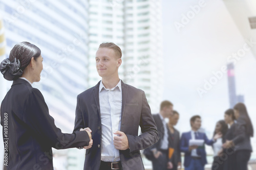 Business people shaking hands, finishing up a meeting background