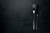 Cutlery. On a wooden background. Top view. Free space for text.