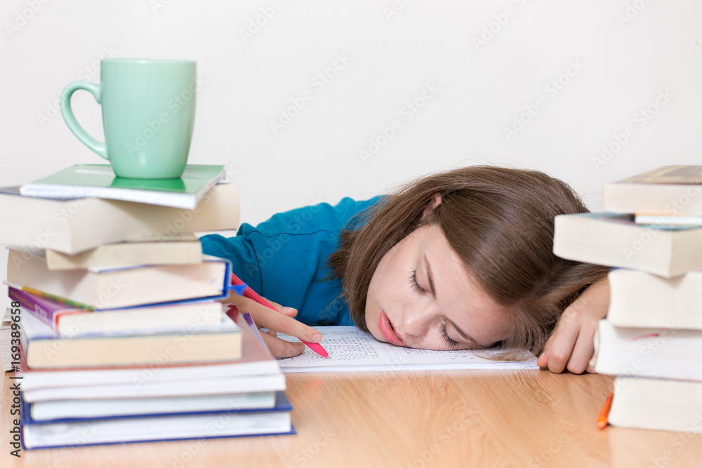 White cute girl asleep and tired of studying, stressed White cute girl asleep and tired of studying, stressed