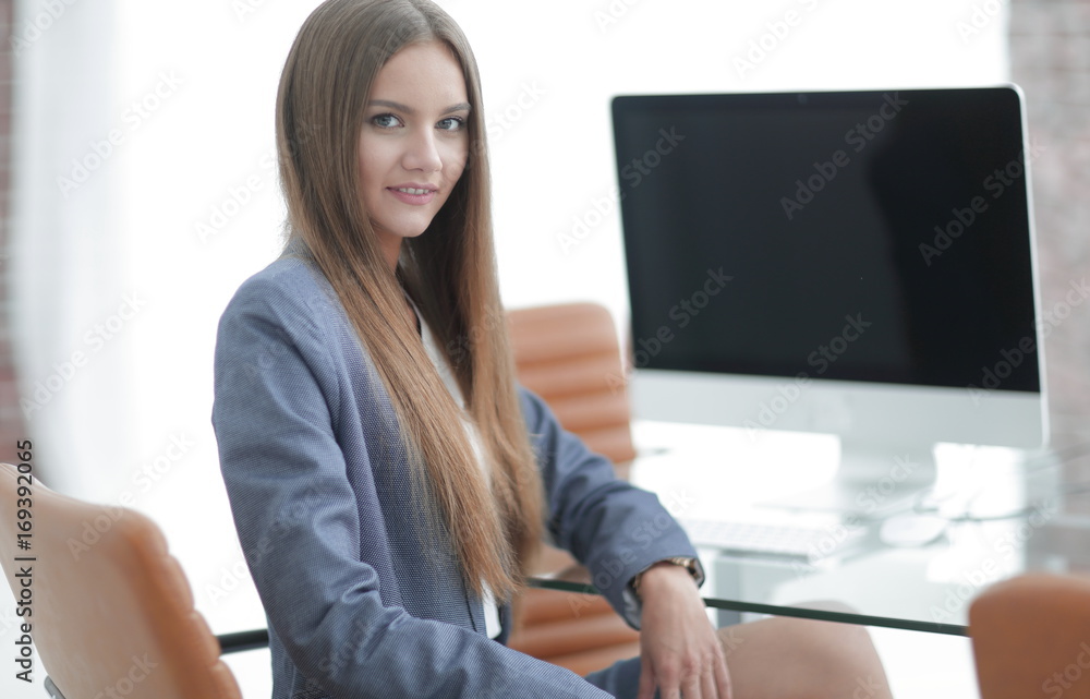 female office employee sitting at a Desk female office employee sitting at a Desk