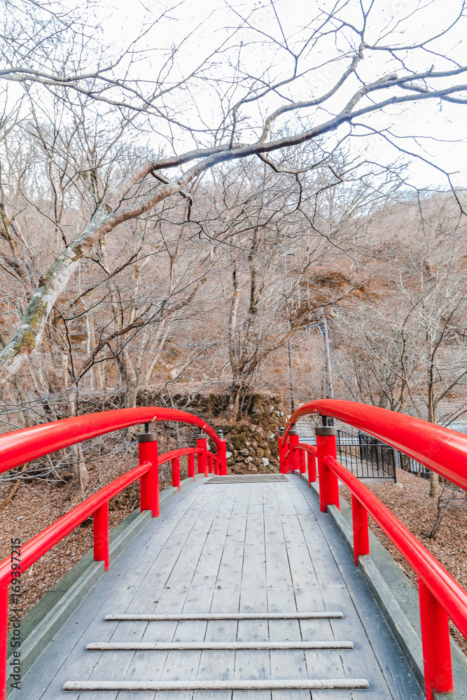 A red bridge in Ikaho Onsen on autumn is a hot spring town located on the eastern slopes of Mount Haruna , famous place of Gunma Prefecture,Japan. A red bridge in Ikaho Onsen on autumn is a hot spring town located on the eastern slopes of Mount Haruna , famous place of Gunma Prefecture,Japan.