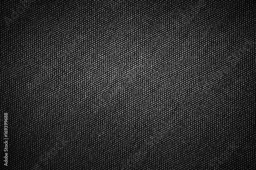 Simple black background sackcloth fabric texture with gray gradient light abstract for product or text backdrop design