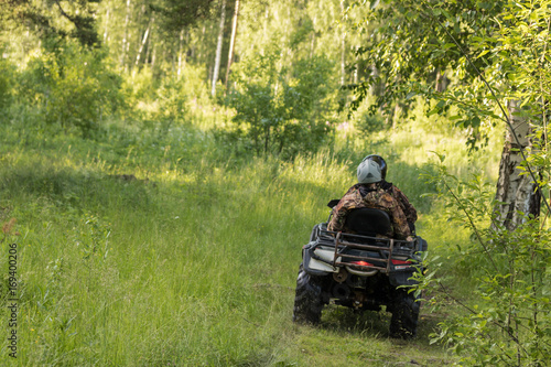 An ATV on a forest road