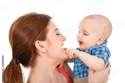 Happy cheerful family. Mother and baby kissing, laughing, hugging and playing. isolated on white background