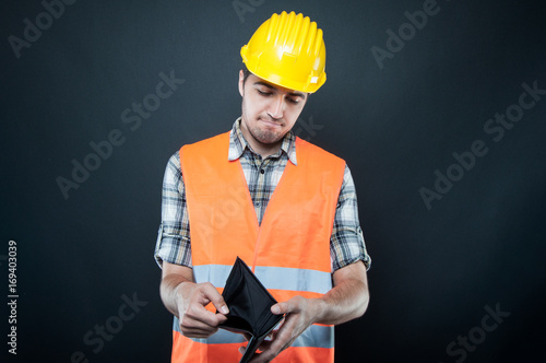 Wallpaper Mural Constructor wearing equipment looking at empty wallet Torontodigital.ca