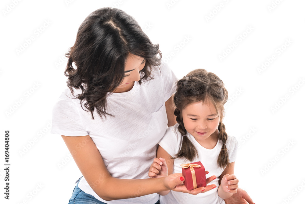 happy asian mother and daughter with gift box, isolated on white happy asian mother and daughter with gift box, isolated on white