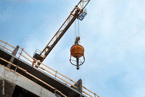 Barrel with cement on towel crane