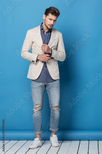 Happy handsome man over blue background