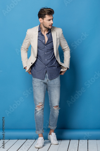 Happy handsome man over blue background