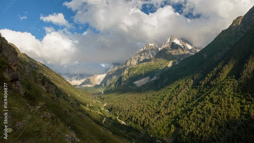 Russia, Republic of Kabardino-Balkaria, time lapse. Summer in the mountains of the Caucasus. Formation and movement of clouds over mountains peaks. Russia, Republic of Kabardino-Balkaria, time lapse. Summer in the mountains of the Caucasus. Formation and movement of clouds over mountains peaks.