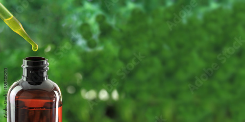 Принти на полотні Dropper over essential oil bottle