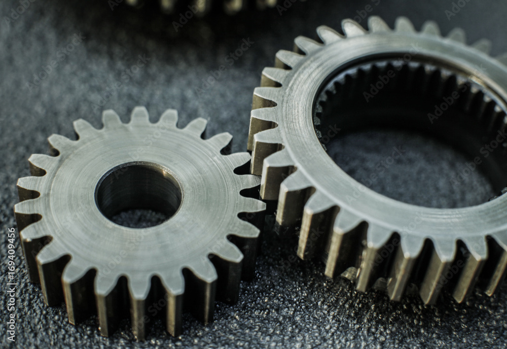 Gears auto set on the rude surface close up Gears auto set on the rude surface close up