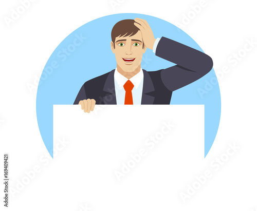 Businessman holding white blank poster and grabbed his head