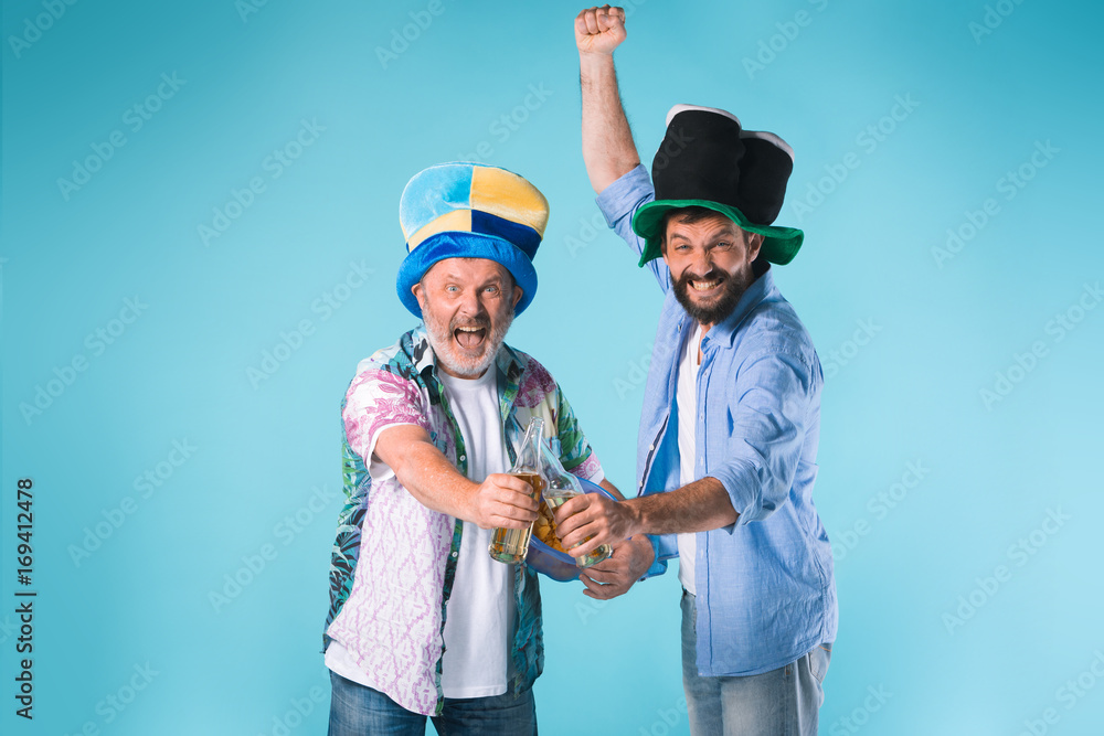 The two football fans over blue The two football fans over blue