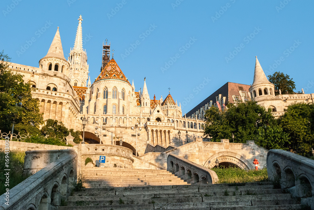 Sunlit Fisherman's Bastion in Budapest, Hungary at Sunrise. View from below.