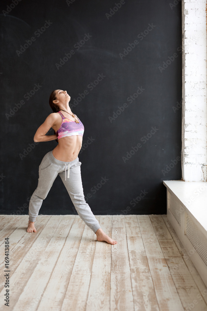 Young woman doing yoga indoors Young woman doing yoga indoors