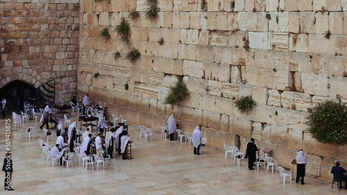 Western Wall or Wailing Wall or Kotel in Jerusalem. People come to pray to the Jerusalem western wall. The Wall is the most sacred place for all jews in the world.