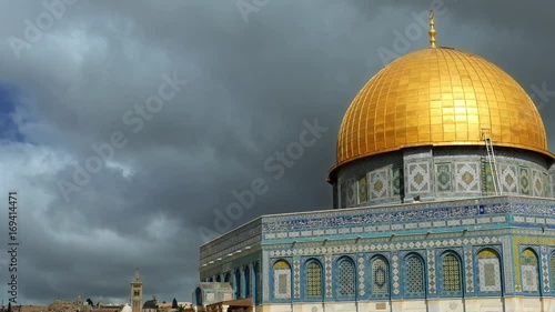 Clouds over Dome of the Rock in Jerusalem over the Temple Mount. Golden Dome is the most known mosque and landmark in Jerusalem and sacred place for all muslims. photo