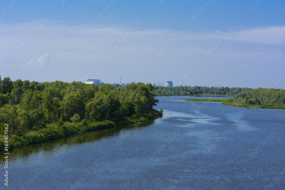 A beautiful river landscape and trees in a dead radioactive zone. Consequences of the Chernobyl nuclear disaster, August 2017. A beautiful river landscape and trees in a dead radioactive zone. Consequences of the Chernobyl nuclear disaster, August 2017.
