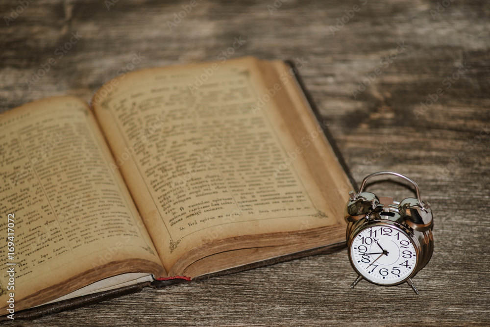 clock on a wooden background clock on a wooden background