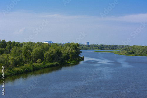 A beautiful river landscape and trees in a dead radioactive zone. Consequences of the Chernobyl nuclear disaster, August 2017.