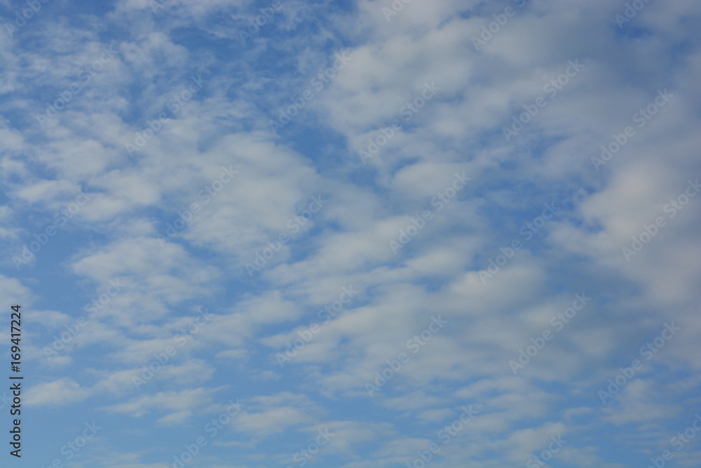 white fluffy clouds in the blue sky white fluffy clouds in the blue sky