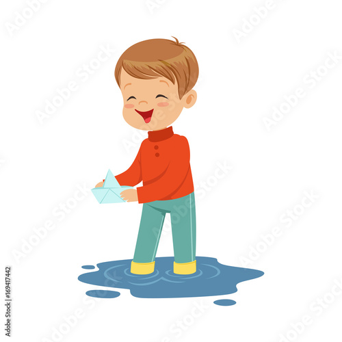 Cute little boy playing with paper boat in a water puddle cartoon vector Illustration