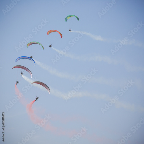 The Flying Dragons aerobatic group of paramotor flying in the Air Show Radom 2017.