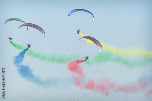 The Flying Dragons aerobatic group of paramotor flying in the Air Show Radom 2017.