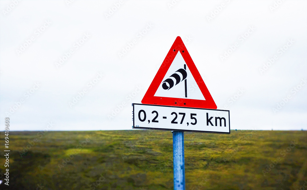 Strong wind hazard sign post in Norway