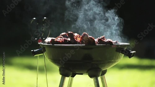 barbecue meat on grill or brazier outdoors photo