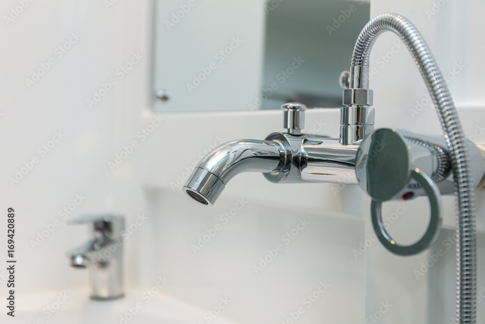 Close up of chrome bath shower tap Close up of chrome bath shower tap