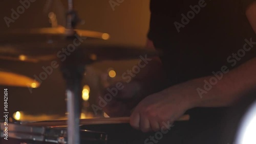 The musician plays the drums