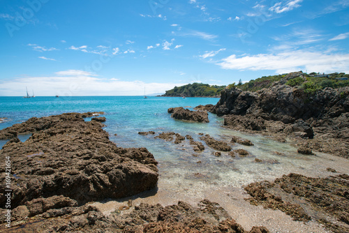 Panorama of stone seashore and blue sea New Zealand
